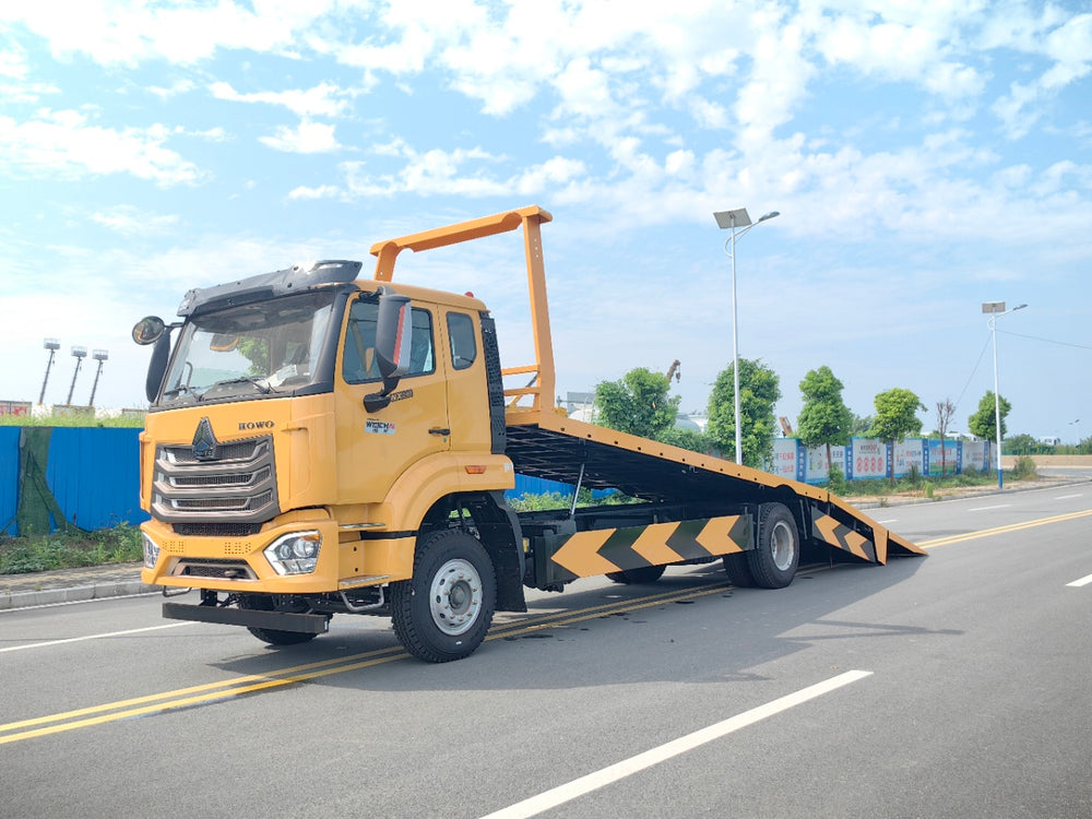 Sinotruk Howo NX flatbed tow truck