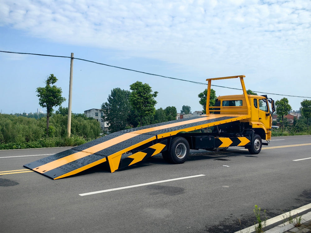 Sinotruk Howo NX flatbed tow truck