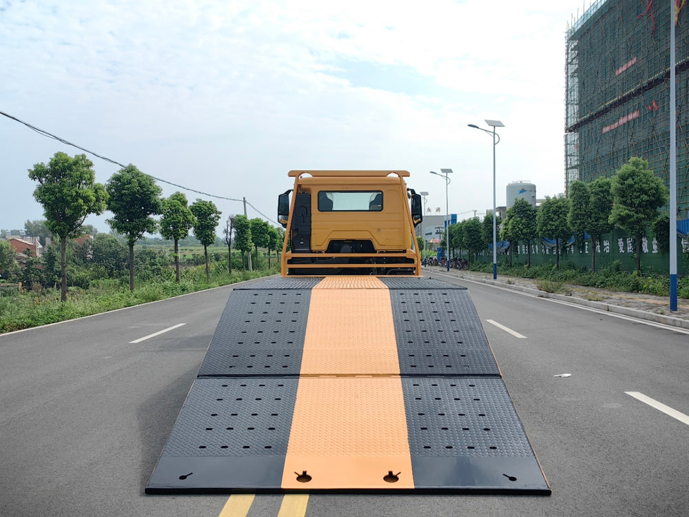 Sinotruk Howo NX flatbed tow truck