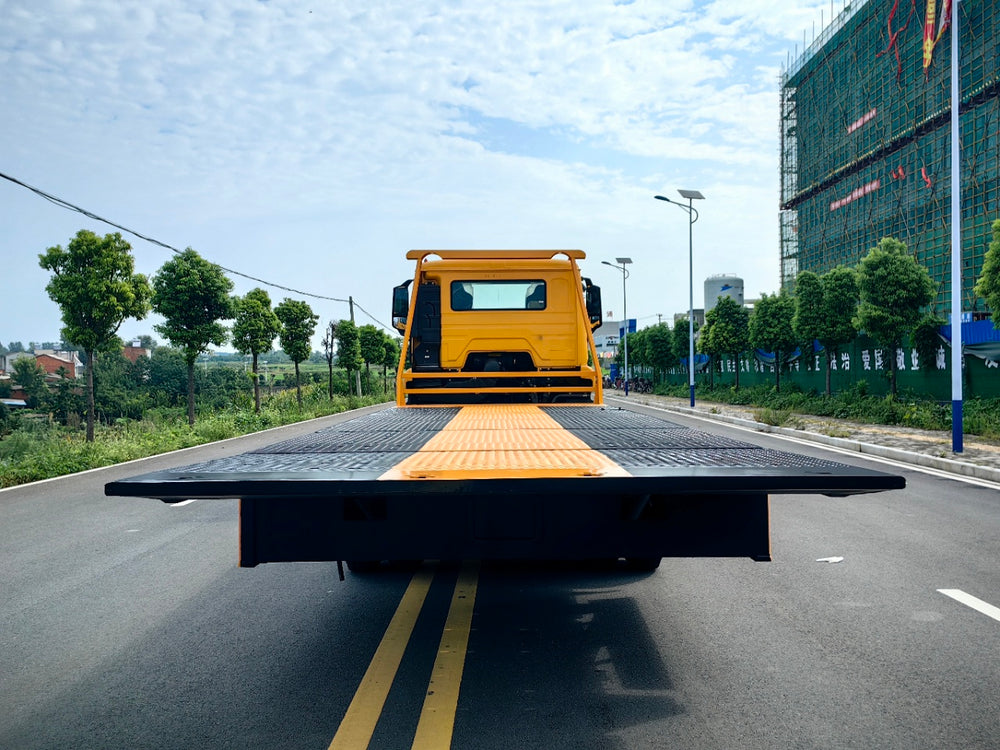 Sinotruk Howo NX flatbed tow truck